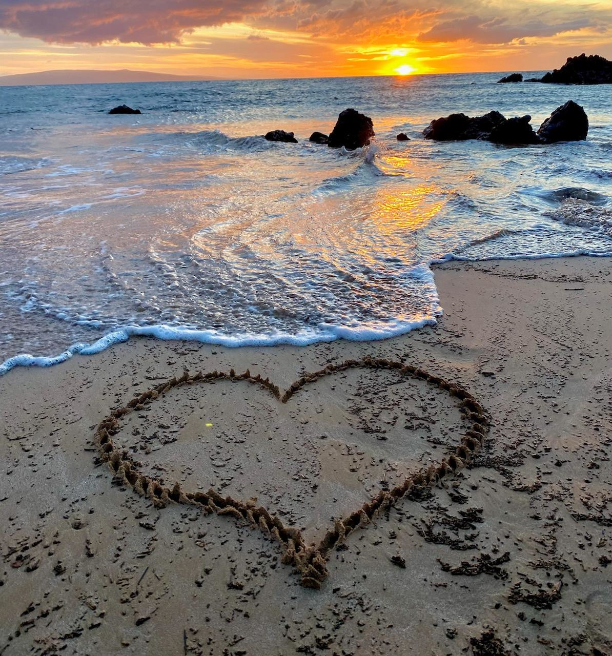 Ocean shore with a heart in sand